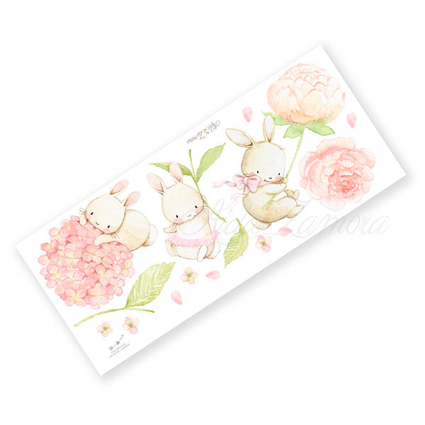 Unpacked product sheet of Floral Bunnies fabric wall decals showing all watercolor bunnies and peony stickers before placement