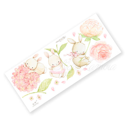 Unpacked product sheet of Floral Bunnies fabric wall decals showing all watercolor bunnies and peony stickers before placement