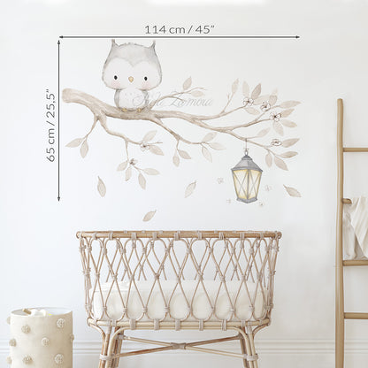 Size guide showing 45 inches by 25.5 inches dimensions for watercolor owl on a branch fabric wall decal above a rattan crib