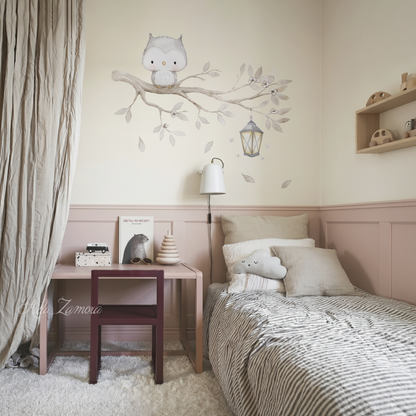 Watercolor owl on a tree branch fabric wall decal installed on a wall above a kids bed and desk in a dust pink nursery